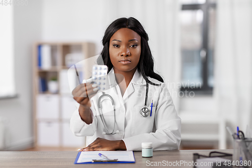 Image of african american doctor with medicine at hospital