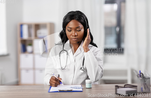 Image of african american doctor with headset at hospital