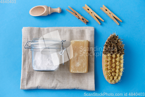 Image of brush, washing soda, soap, scoop and clothespins