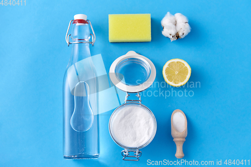 Image of lemon, washing soda, vinegar, sponge and cotton