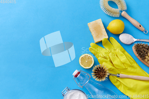 Image of vinegar, lemons, washing soda, gloves and brush