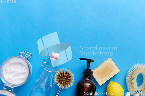 Image of lemons, soap, washing soda, vinegar and brushes