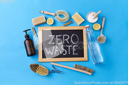 Image of zero waste words on chalkboard and cleaning stuff