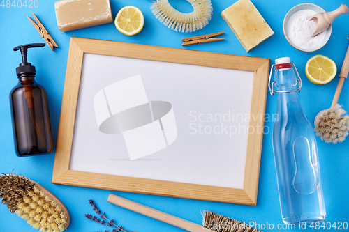 Image of natural cleaning supplies around white board