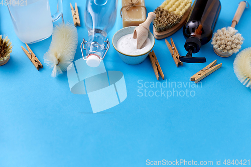 Image of soda, vinegar, clothespins, soap and brushes