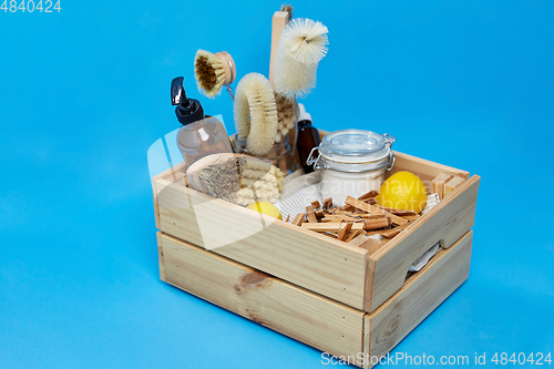 Image of box with clothespins and natural cleaning supplies