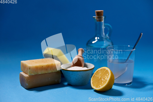 Image of washing soda, lemon, sponge, soap and vinegar