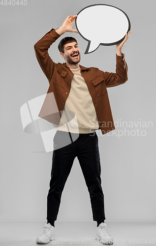 Image of happy man with speech bubble over grey background