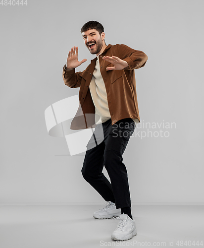 Image of happy smiling young man with mustaches