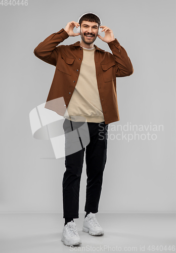 Image of happy smiling young man in headphones