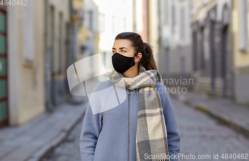 Image of woman wearing protective reusable barrier mask