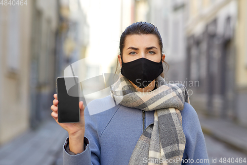 Image of woman wearing protective reusable barrier mask