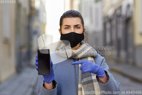 Image of woman wearing protective reusable barrier mask