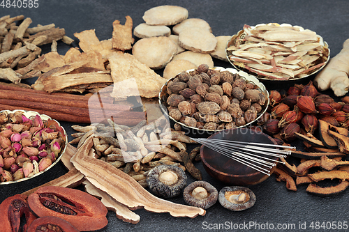 Image of Natural Chinese Herbal Medicine with Acupuncture Needles