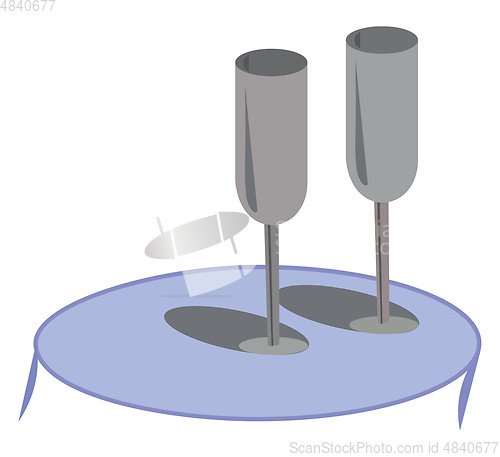 Image of Elegant grey glasswares lying on a blue coffee table vector or c