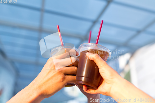 Image of Friends drink coffee together