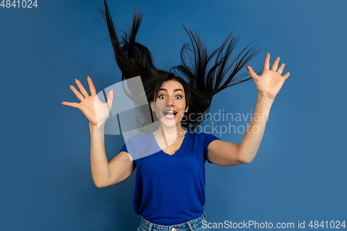 Image of Caucasian woman\'s portrait isolated on blue studio background