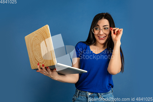 Image of Caucasian woman\'s portrait isolated on blue studio background