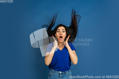 Image of Caucasian woman\'s portrait isolated on blue studio background