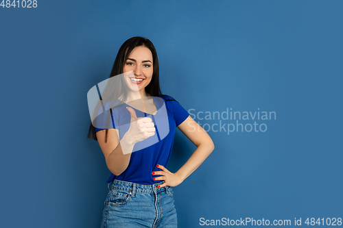 Image of Caucasian woman\'s portrait isolated on blue studio background