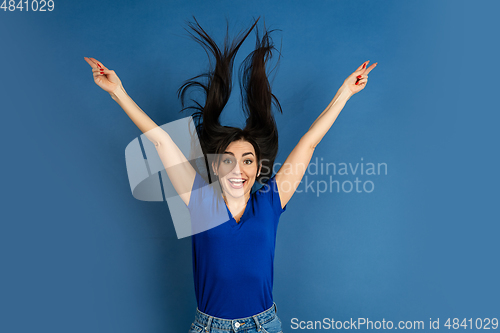 Image of Caucasian woman\'s portrait isolated on blue studio background