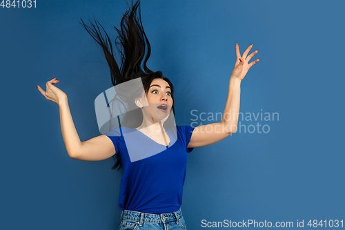 Image of Caucasian woman\'s portrait isolated on blue studio background