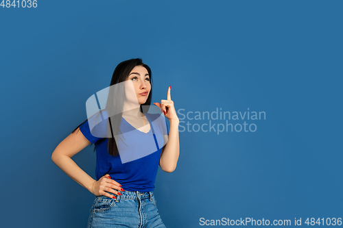 Image of Caucasian woman\'s portrait isolated on blue studio background