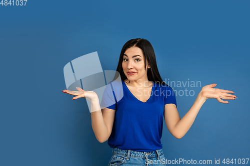 Image of Caucasian woman\'s portrait isolated on blue studio background