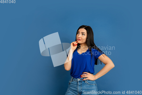 Image of Caucasian woman\'s portrait isolated on blue studio background