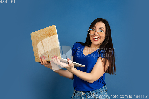Image of Caucasian woman\'s portrait isolated on blue studio background