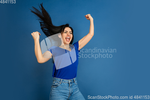 Image of Caucasian woman\'s portrait isolated on blue studio background