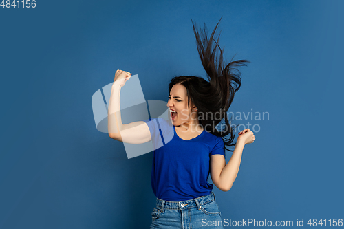 Image of Caucasian woman\'s portrait isolated on blue studio background