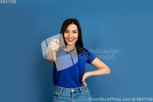 Image of Caucasian woman\'s portrait isolated on blue studio background