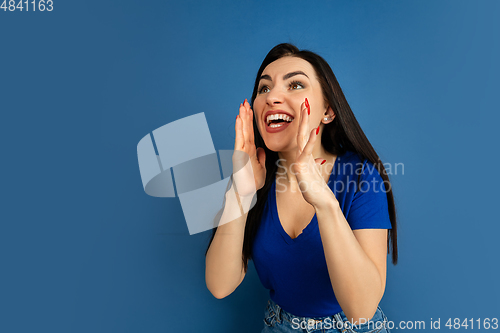 Image of Caucasian woman\'s portrait isolated on blue studio background