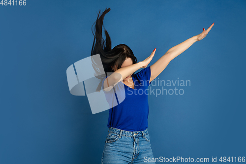 Image of Caucasian woman\'s portrait isolated on blue studio background