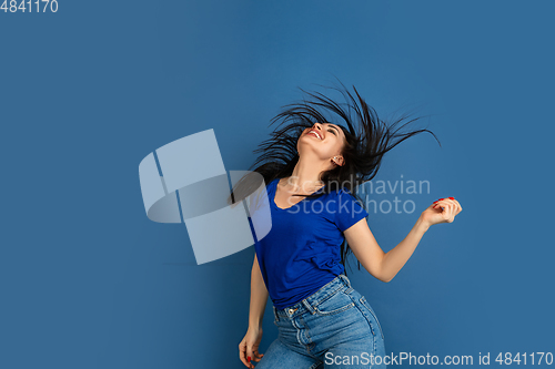 Image of Caucasian woman\'s portrait isolated on blue studio background