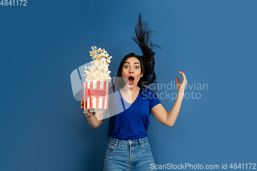 Image of Caucasian woman\'s portrait isolated on blue studio background