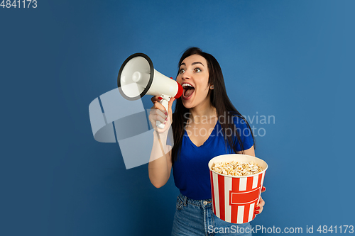 Image of Caucasian woman\'s portrait isolated on blue studio background