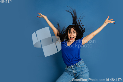 Image of Caucasian woman\'s portrait isolated on blue studio background