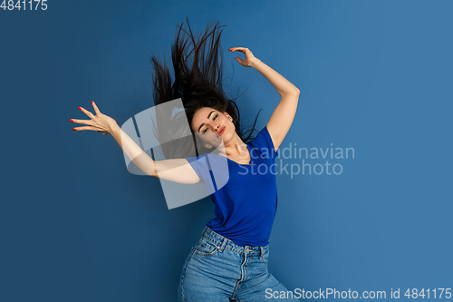 Image of Caucasian woman\'s portrait isolated on blue studio background