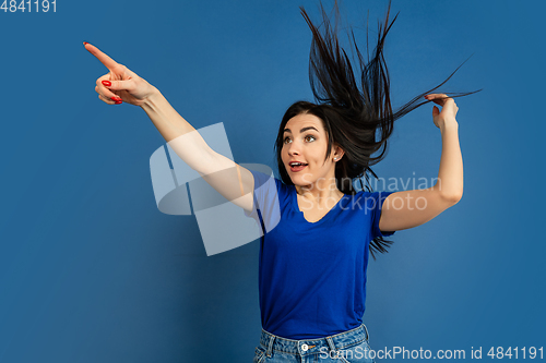 Image of Caucasian woman\'s portrait isolated on blue studio background