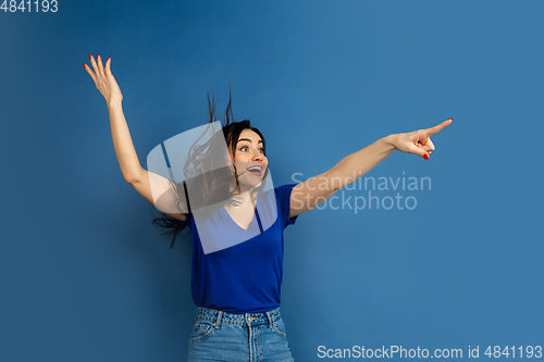 Image of Caucasian woman\'s portrait isolated on blue studio background