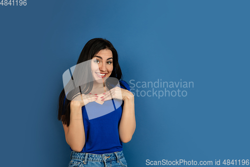 Image of Caucasian woman\'s portrait isolated on blue studio background