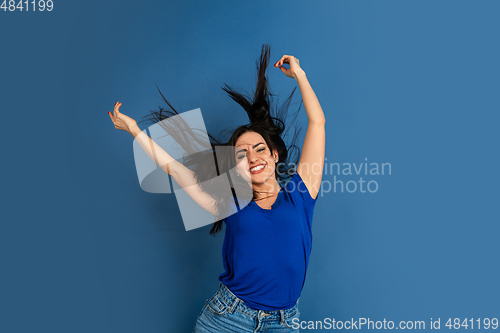 Image of Caucasian woman\'s portrait isolated on blue studio background