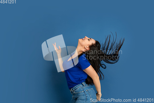 Image of Caucasian woman\'s portrait isolated on blue studio background