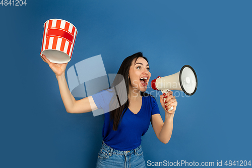 Image of Caucasian woman\'s portrait isolated on blue studio background