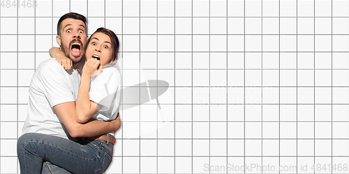 Image of Caucasian couple portrait on mosaic tiles on the background, flyer