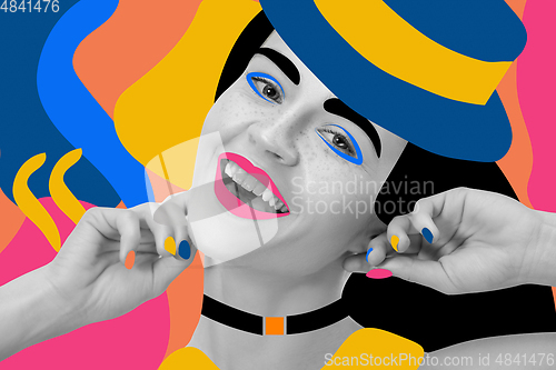 Image of Portrait of a beautiful young woman with bright colorful painted design