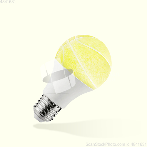 Image of Contemporary modern art collage with unusual light yellow basket-ball.