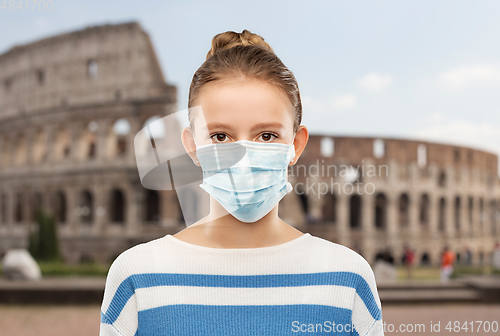 Image of teenage girl in medical mask over coliseum, italy